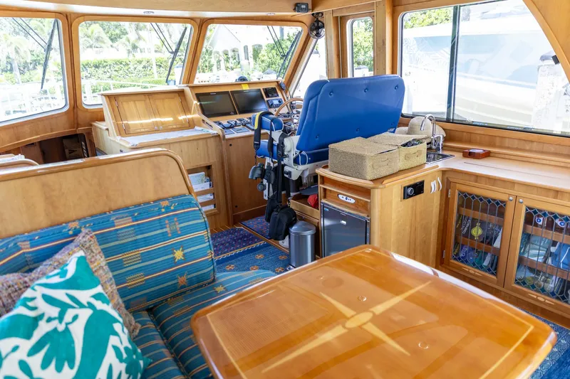 Yacht Photos Pics Interior of 2009 Sabre 52 Express yacht with wooden furnishings and blue seating.