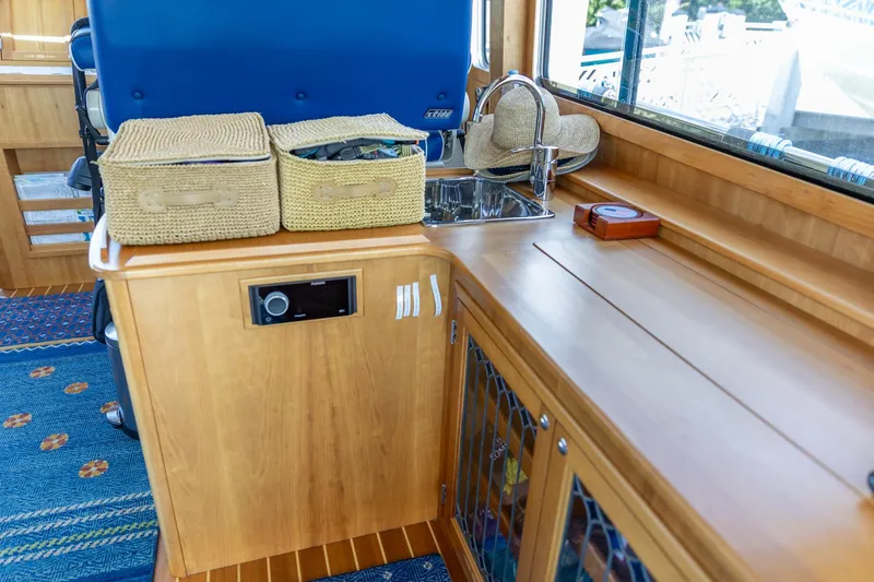  Yacht Photos Pics Interior of 2009 Sabre 52 Express yacht with wooden cabinetry and sink.