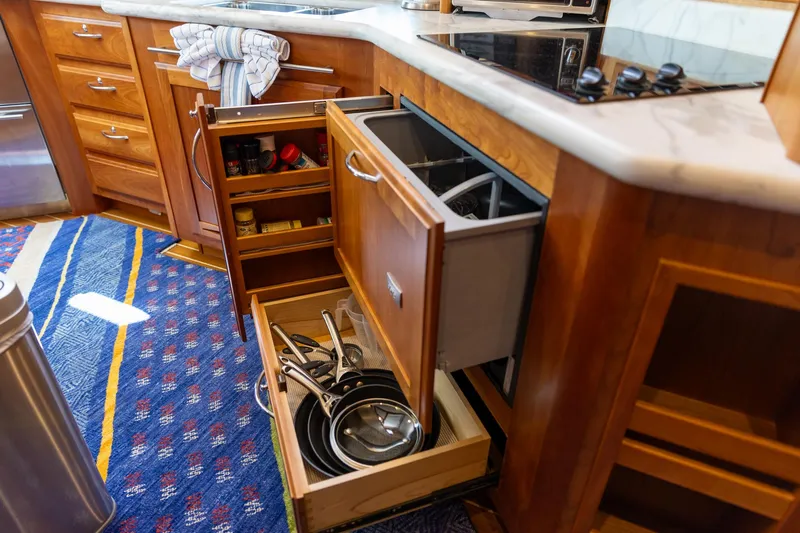  Yacht Photos Pics Galley kitchen in 2009 Sabre 52 Express yacht with open drawers and cookware.