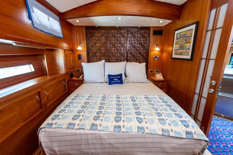  Yacht Photos Pics Luxurious cabin interior of 2009 Sabre 52 Express yacht with elegant bedding and wood finish.