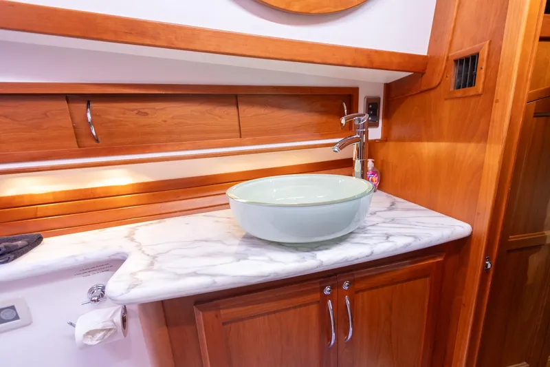  Yacht Photos Pics Marble countertop with vessel sink in 2009 Sabre 52 Express yacht bathroom.