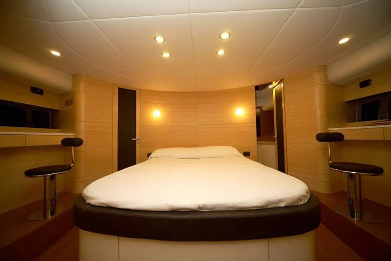 Ea Yacht Photos Pics Luxurious bedroom interior of 2010 Custom Wake 66 yacht with modern lighting and seating.