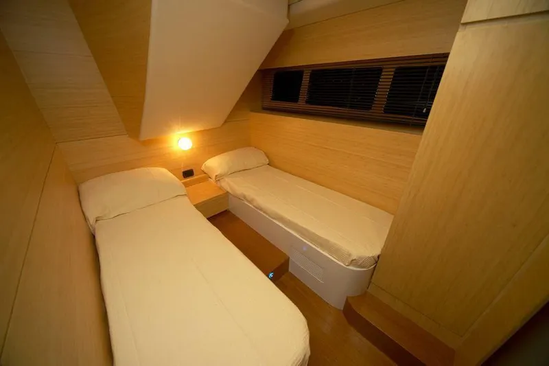 Ea Yacht Photos Pics Compact twin cabin with wooden interior in 2010 Custom Wake 66 yacht.