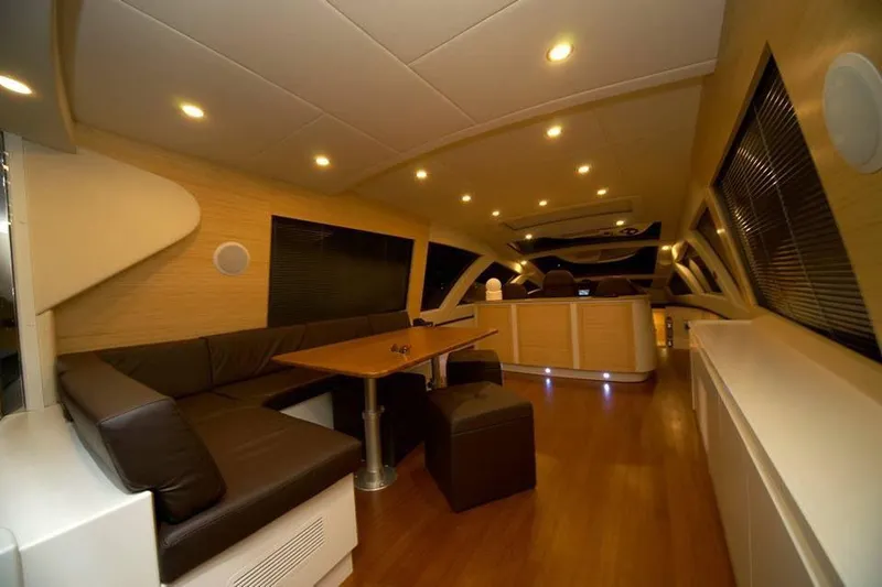 Ea Yacht Photos Pics Luxurious interior of 2010 Custom Wake 66 yacht with modern seating and ambient lighting.