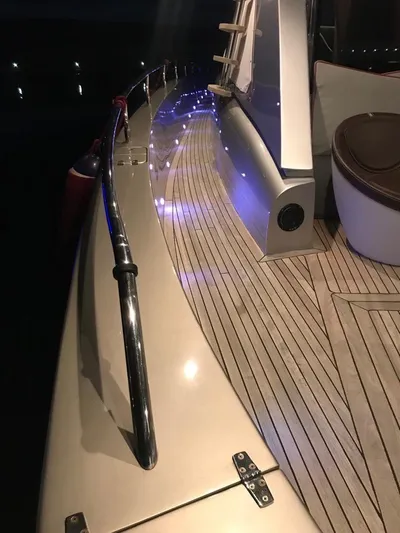 Ea Yacht Photos Pics Custom Wake 66 yacht deck with ambient lighting, sleek design, and wooden flooring, 2010 model.