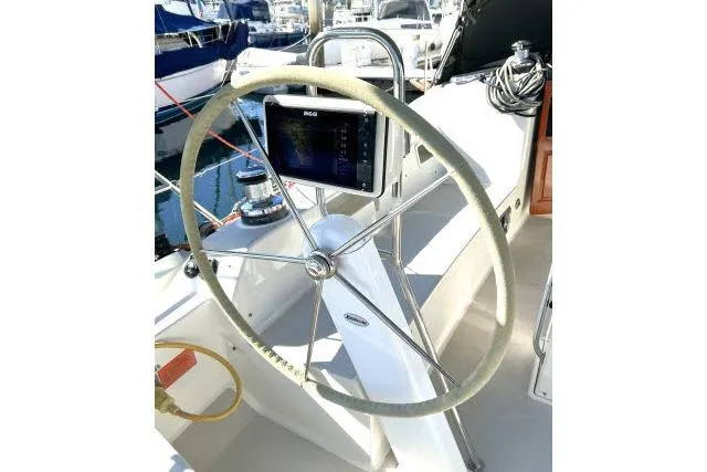Resolute Yacht Photos Pics Steering wheel of 2015 Blue Jacket 40 sailboat, featuring navigation equipment.