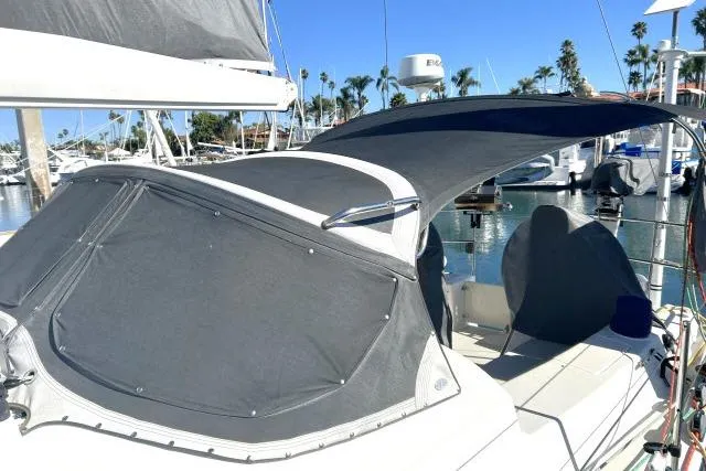 Resolute Yacht Photos Pics Sailboat with gray canopy docked in marina, Blue Jacket 40, 2015 model.