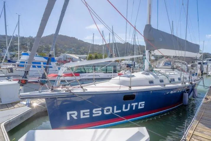 Resolute Yacht Photos Pics Sailboat "Resolute" docked, Blue Jacket 40 model, 2015, in a marina setting.