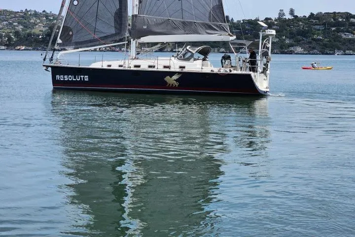 Resolute Yacht Photos Pics Sailboat "Resolute" on calm water, Blue Jacket 40 model, 2015.