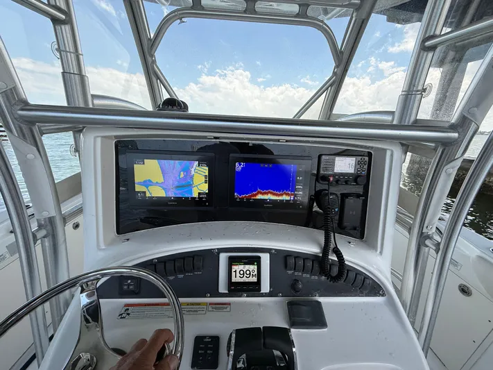  Yacht Photos Pics Control panel of 2008 Boston Whaler 320 Outrage boat with navigation screens.