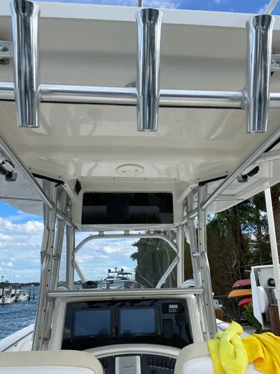  Yacht Photos Pics 2008 Boston Whaler 320 Outrage boat interior with rod holders and navigation equipment.