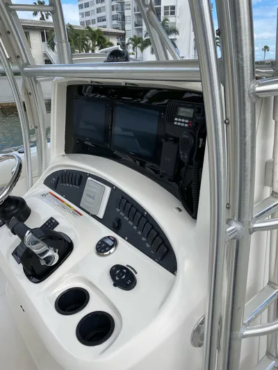  Yacht Photos Pics 2008 Boston Whaler 320 Outrage helm with modern navigation equipment and controls.
