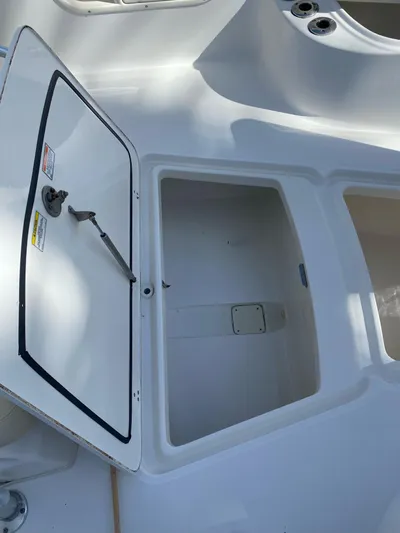  Yacht Photos Pics Open storage compartment on a 2008 Boston Whaler 320 Outrage boat.