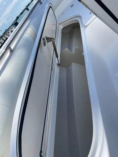  Yacht Photos Pics 2008 Boston Whaler 320 Outrage storage compartment, open view, showcasing spacious interior.