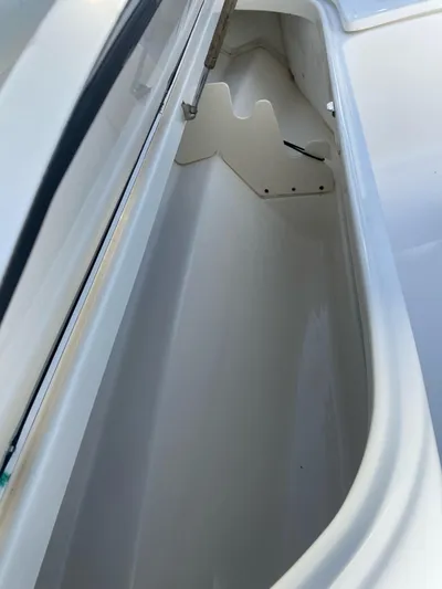  Yacht Photos Pics Storage compartment of 2008 Boston Whaler 320 Outrage boat, open and empty.