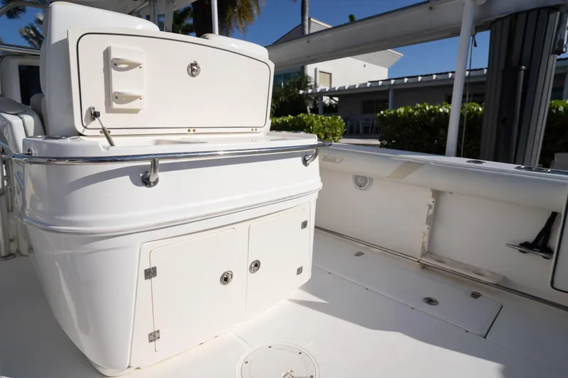  Yacht Photos Pics 2008 Boston Whaler 320 Outrage boat interior with storage compartments and seating.
