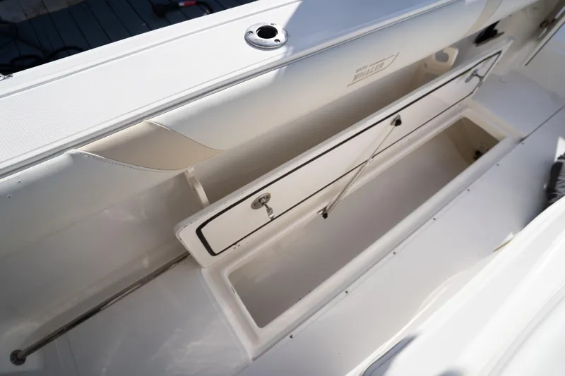  Yacht Photos Pics 2008 Boston Whaler 320 Outrage storage compartment, open and empty, showcasing interior space.