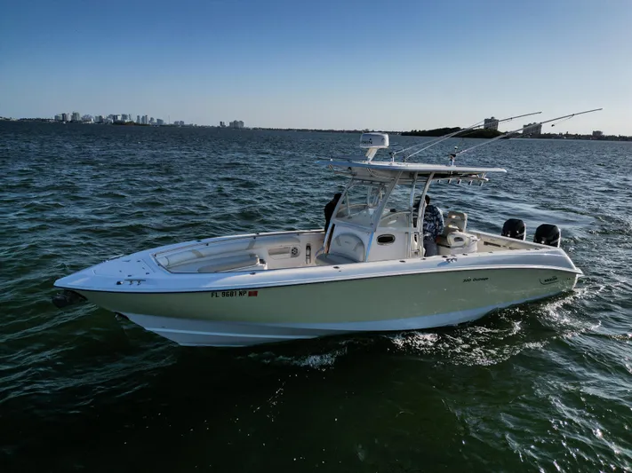  Yacht Photos Pics 2008 Boston Whaler 320 Outrage boat on open water, clear sky background.