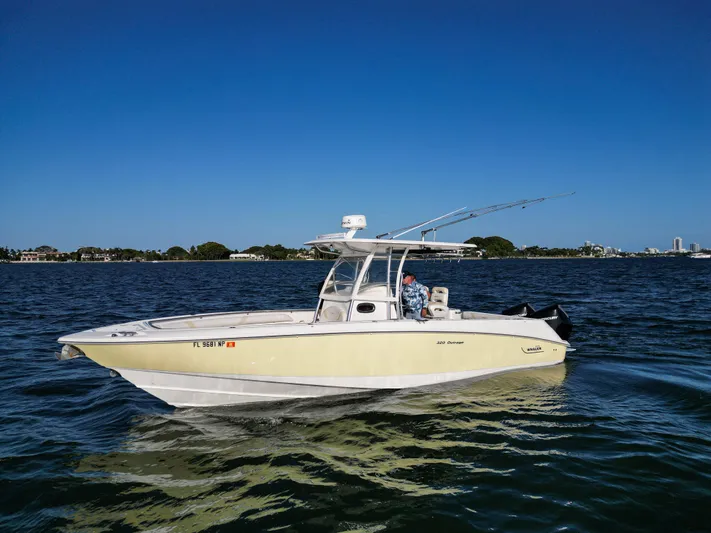  Yacht Photos Pics 2008 Boston Whaler 320 Outrage boat cruising on a sunny day.