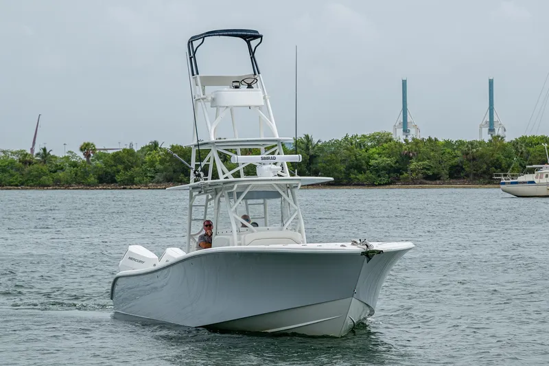  Yacht Photos Pics 2013 Yellowfin 39 Offshore boat cruising on a calm waterway.