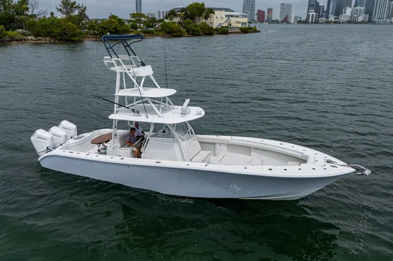  Yacht Photos Pics 2013 Yellowfin 39 Offshore boat on water, featuring triple outboard engines.