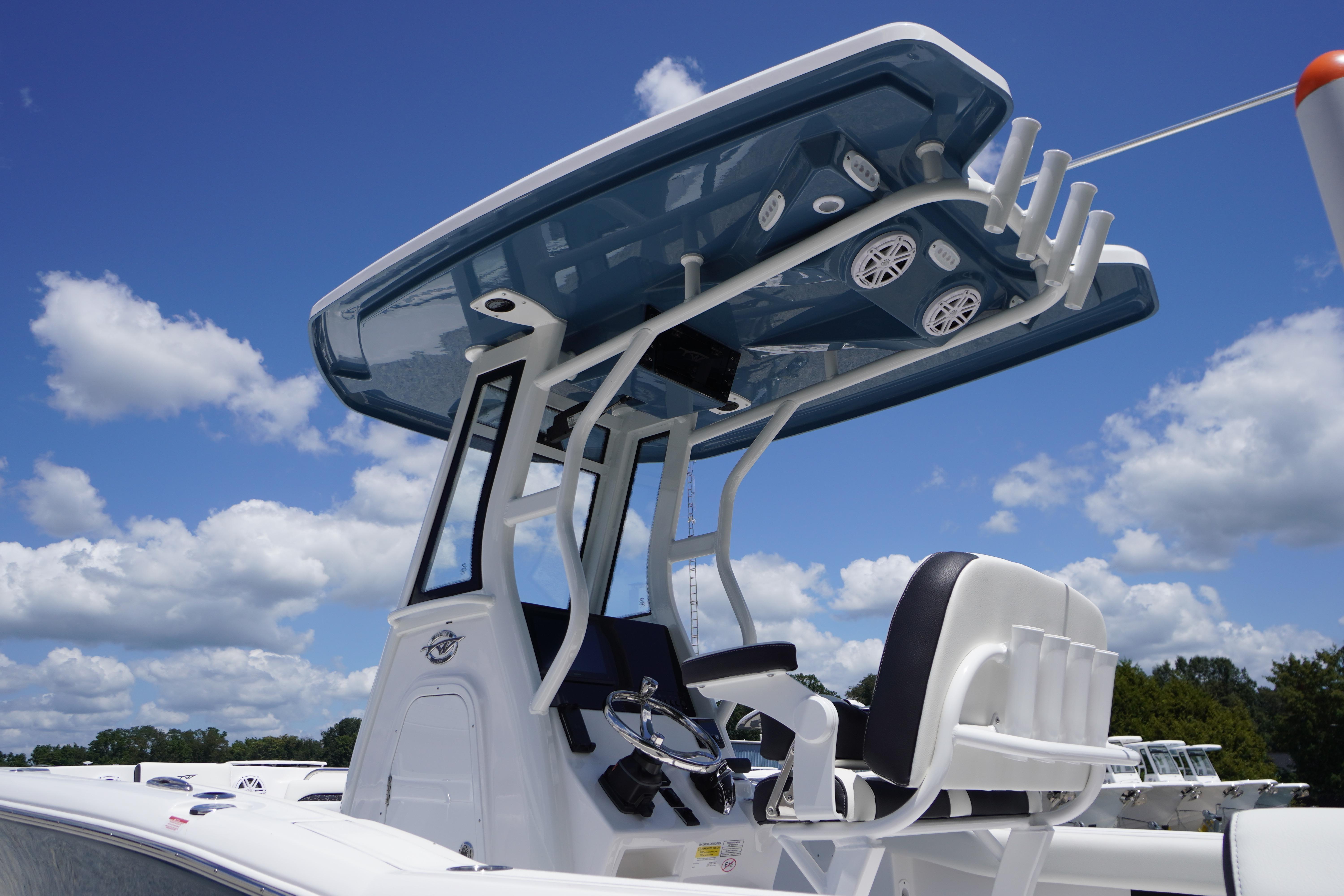 2026 Tidewater 232 LXF boat with T-top and seating, under a clear blue sky.