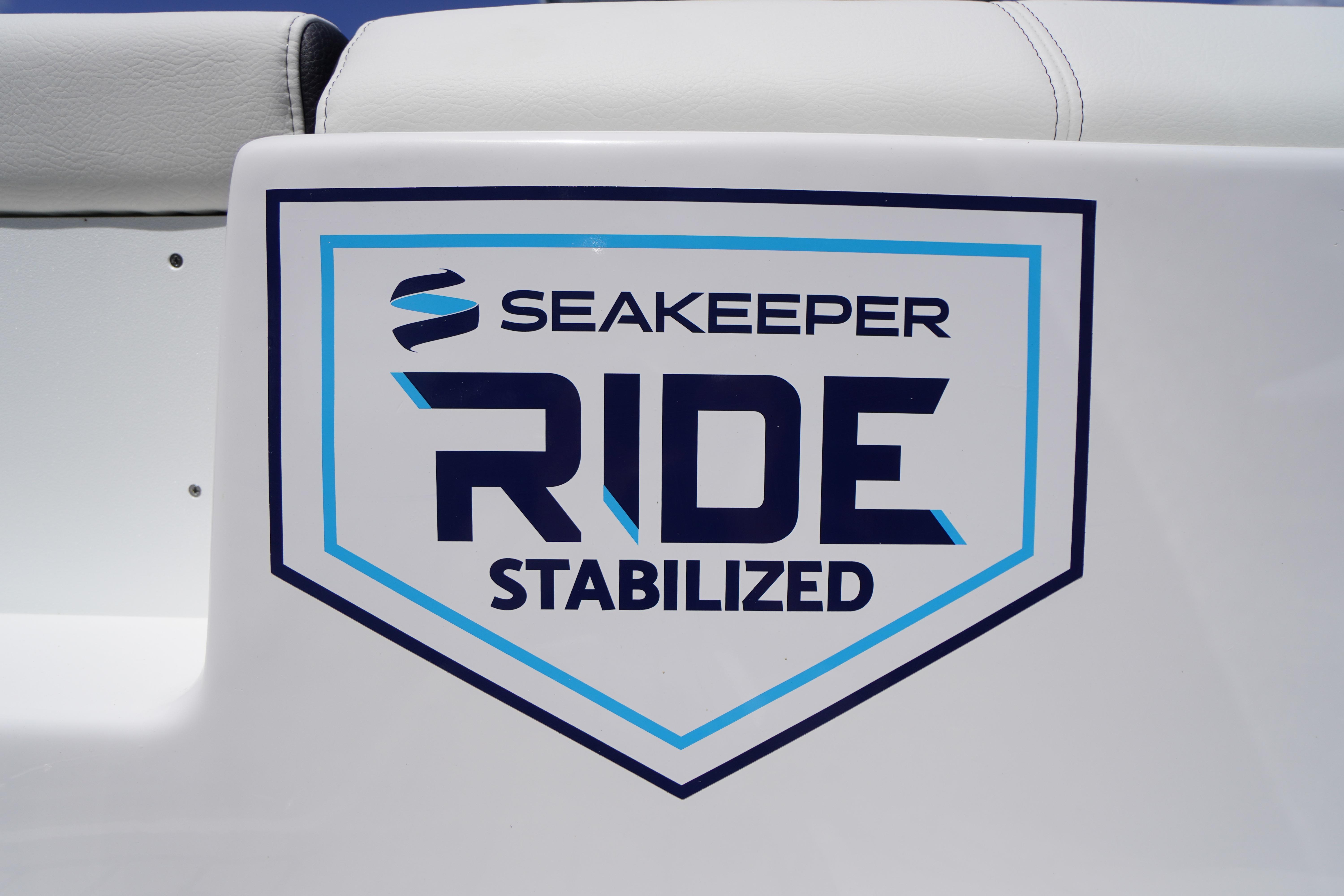 2026 Tidewater 232 LXF boat featuring Seakeeper Ride stabilization logo.