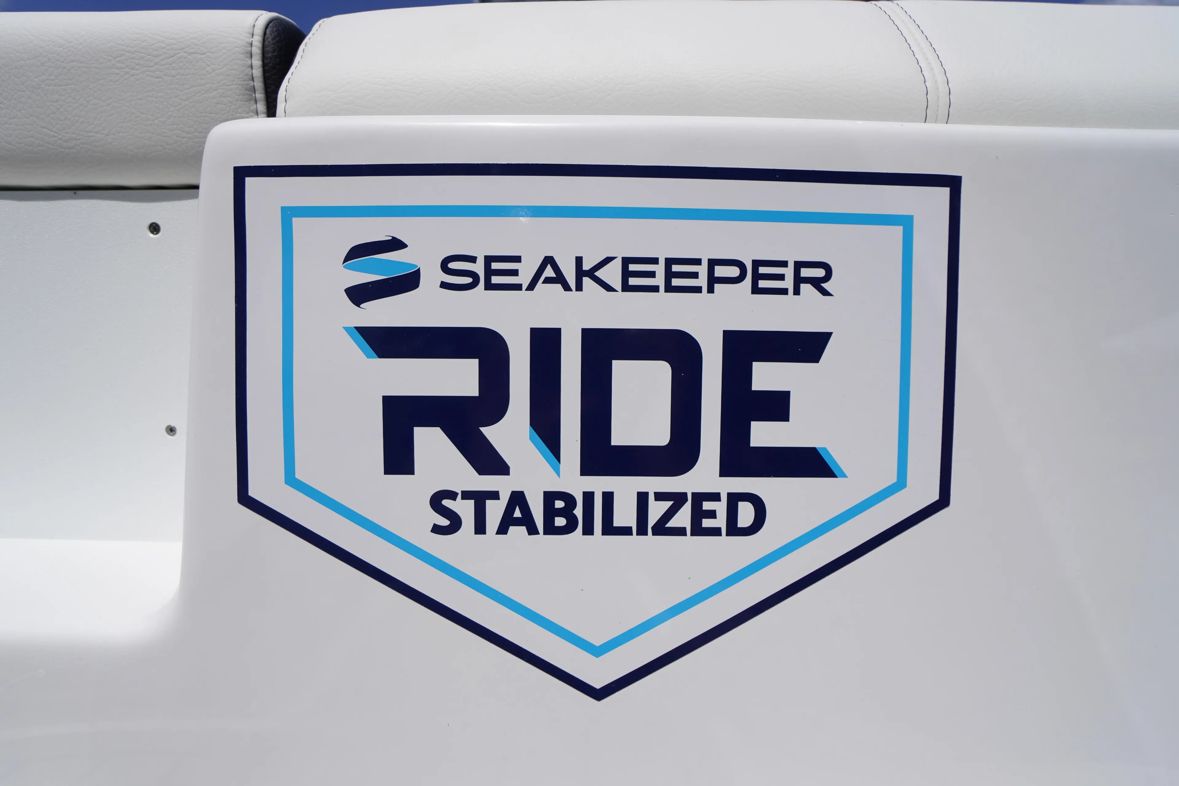 2026 Tidewater 232 LXF boat featuring Seakeeper Ride stabilization logo.