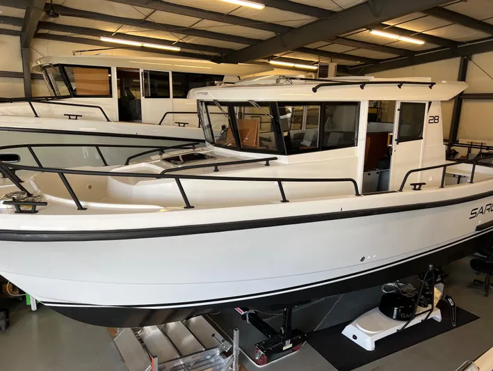  Yacht Photos Pics 2024 Sargo 28 boat in showroom, white exterior, side view.