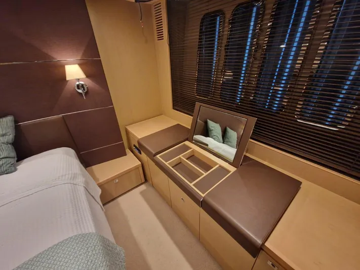  Yacht Photos Pics Luxurious cabin interior of a 2010 Princess V62 yacht with elegant furnishings and ambient lighting.