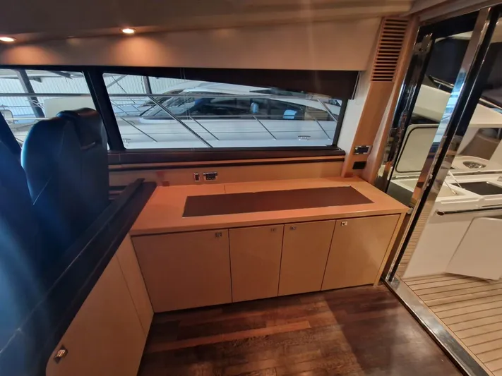  Yacht Photos Pics Interior of 2010 Princess V62 yacht with sleek cabinetry and modern design.