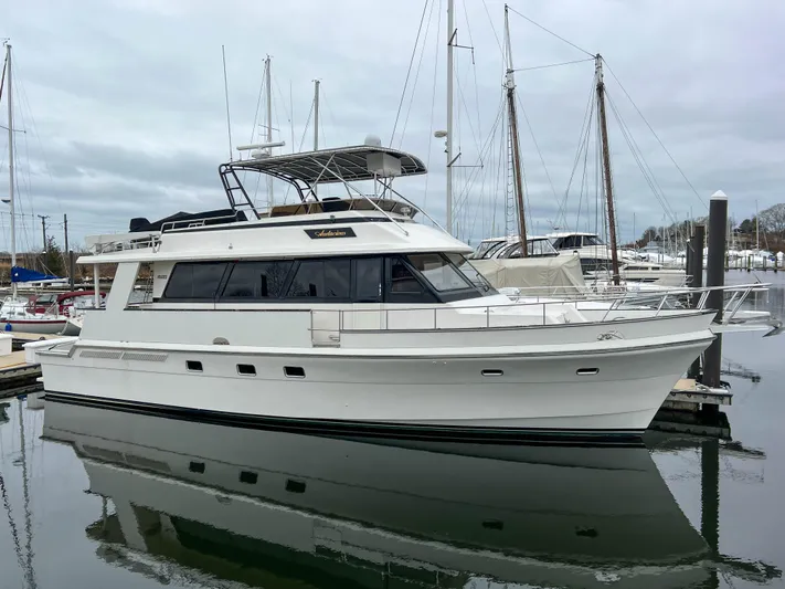 Audacious Yacht Photos Pics 1986 Southern Cross 53 yacht docked at marina, overcast sky.