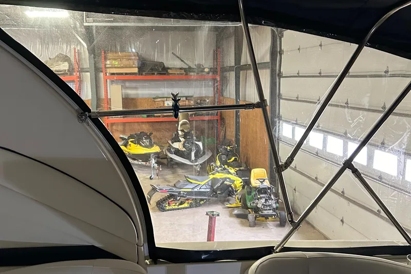  Yacht Photos Pics Interior view from 2005 Sea Ray 390 Sundancer, showing garage with jet skis and equipment.