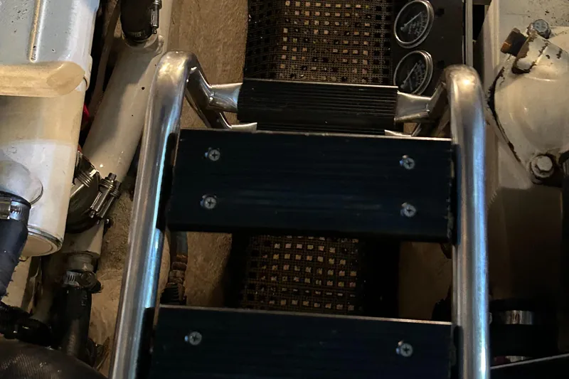  Yacht Photos Pics Engine room ladder of 2005 Sea Ray 390 Sundancer with gauges and equipment.