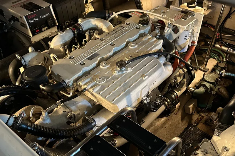  Yacht Photos Pics Engine room of a 2005 Sea Ray 390 Sundancer, showcasing detailed mechanical components.