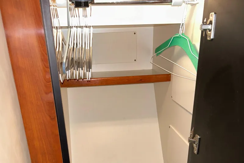  Yacht Photos Pics Empty closet with hangers inside a 2005 Sea Ray 390 Sundancer yacht.