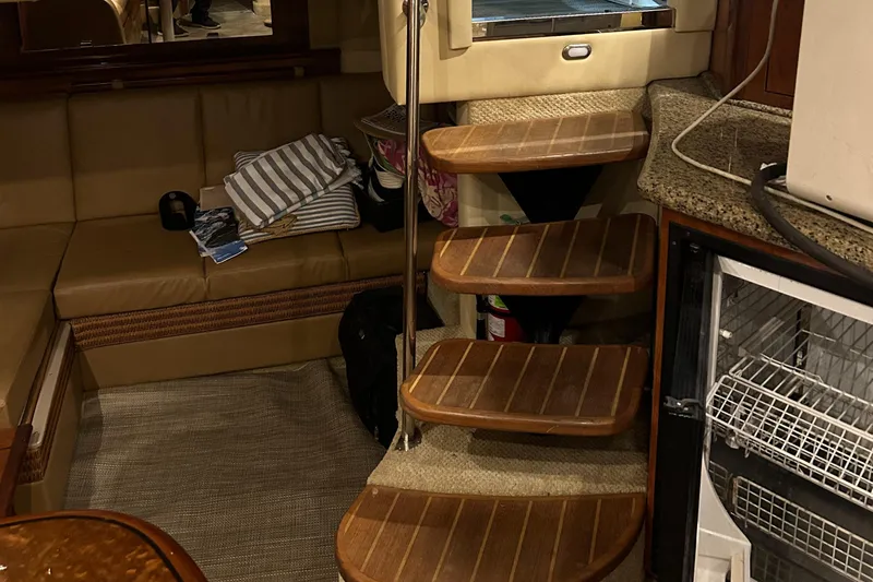  Yacht Photos Pics Interior of 2005 Sea Ray 390 Sundancer with wooden steps and seating area.
