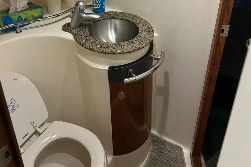  Yacht Photos Pics 2005 Sea Ray 390 Sundancer bathroom with modern sink and toilet.