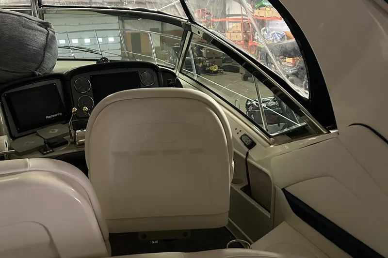  Yacht Photos Pics Interior cockpit of 2005 Sea Ray 390 Sundancer boat, featuring helm and seating.