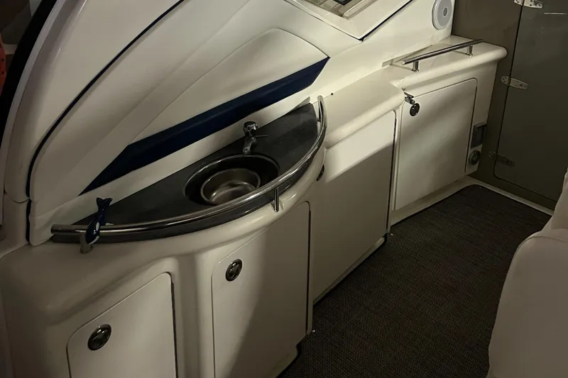  Yacht Photos Pics 2005 Sea Ray 390 Sundancer interior with sink and storage cabinets.