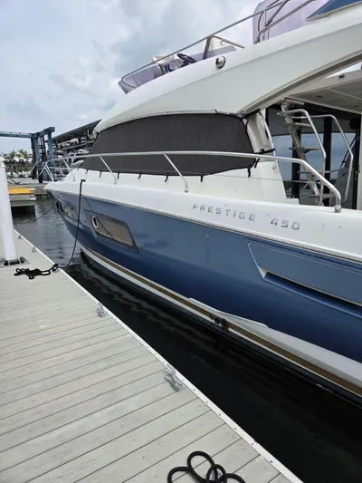  Yacht Photos Pics 2015 Prestige 450 Fly yacht docked at marina, side view.