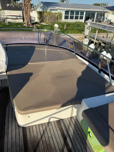  Yacht Photos Pics Prestige 450 Fly 2015 yacht deck with cushioned seating and waterfront view.
