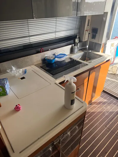  Yacht Photos Pics Modern kitchen interior on a 2015 Prestige 450 Fly yacht, featuring sleek countertops and appliances.