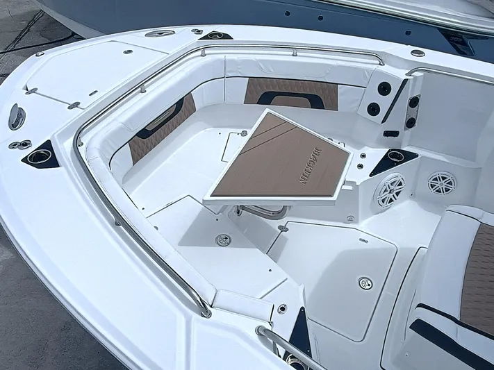 272-499 Yacht Photos Pics 2025 Blackfin 272 CC boat interior with seating and table, featuring sleek design and modern amenities.