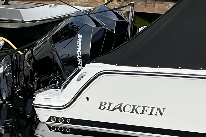  Yacht Photos Pics 2021 Blackfin 252DC boat with Mercury outboard engine docked in marina.