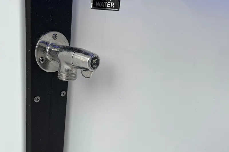  Yacht Photos Pics Chrome faucet on a 2021 Blackfin 252DC boat, labeled "RAW" for water.