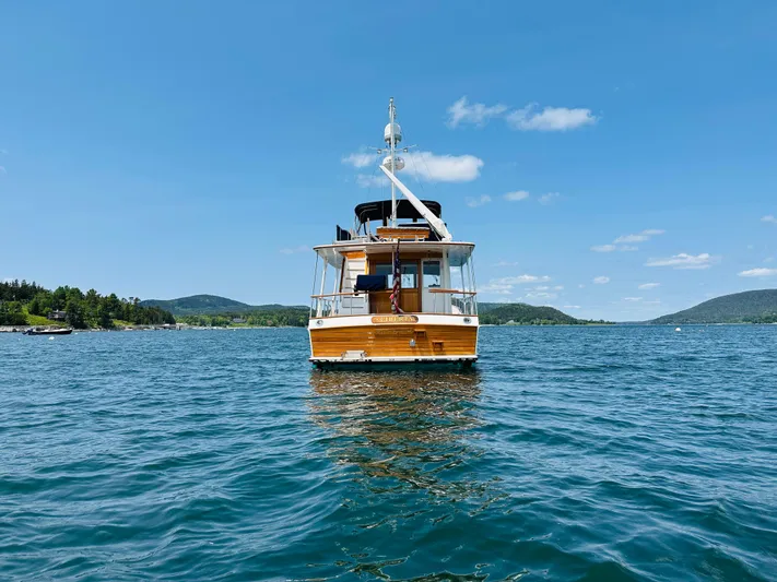 Liberty Yacht Photos Pics Grand Banks 46 Europa yacht on clear blue water, 2003 model, under a sunny sky.