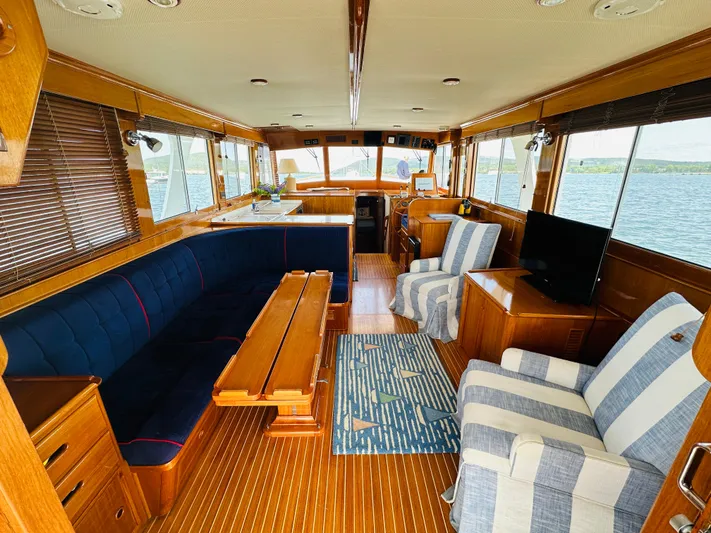 Liberty Yacht Photos Pics Luxurious interior of 2003 Grand Banks 46 Europa yacht with elegant wood finishes and comfortable seating.