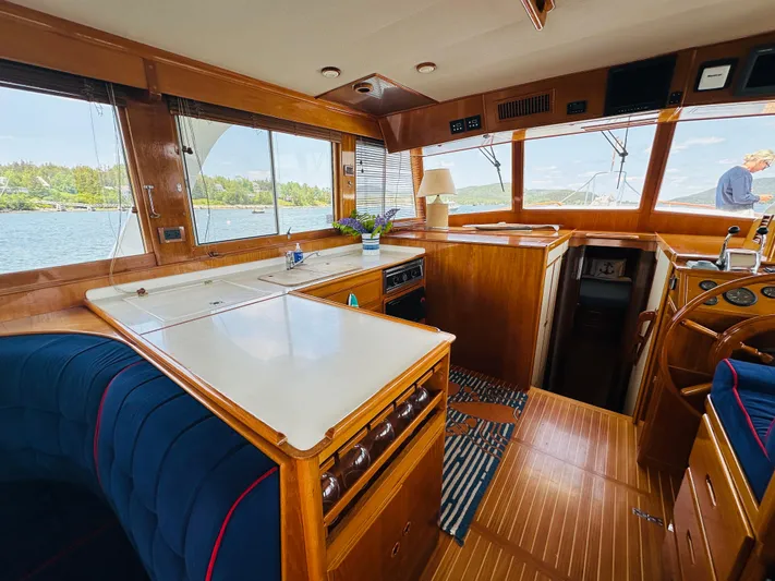 Liberty Yacht Photos Pics Interior of 2003 Grand Banks 46 Europa yacht with wooden finishes and scenic water view.