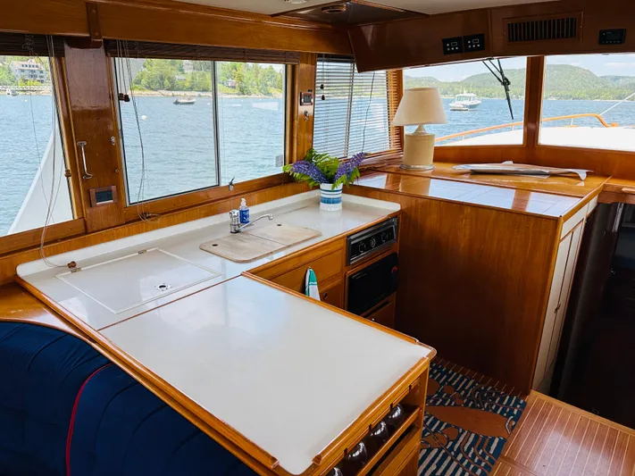 Liberty Yacht Photos Pics Interior of 2003 Grand Banks 46 Europa yacht with kitchen and scenic water view.